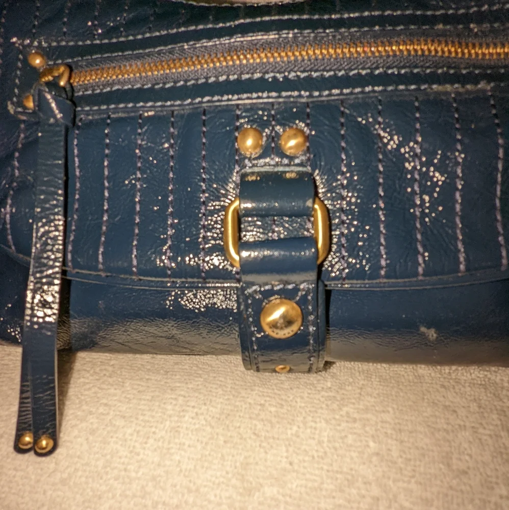 The  Sak navy blue patent leather hobo bag.